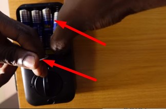 press the pin and reinsert the battery